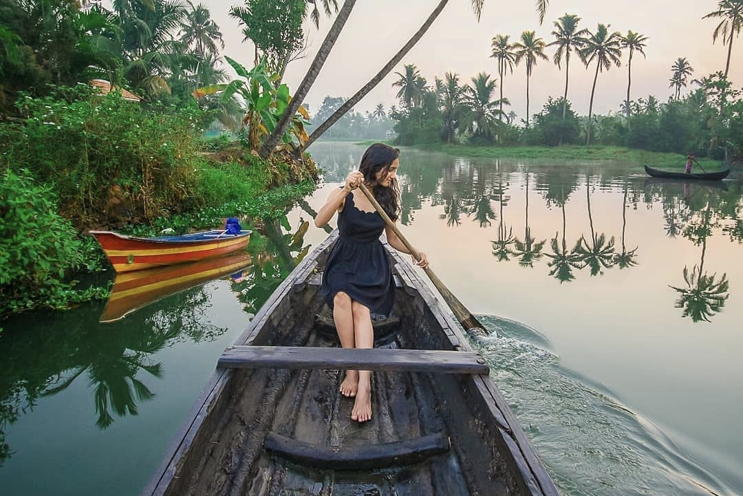 Local fishermen demonstrating traditional fishing methods on Kerala backwaters using age-old techniques and equipment