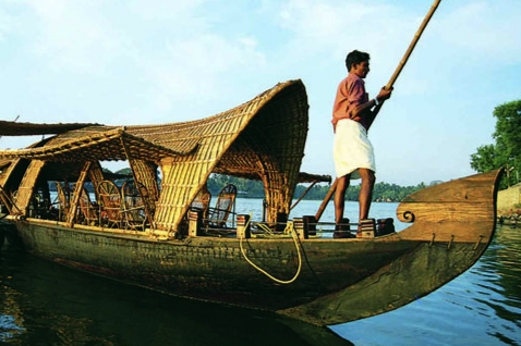 Traditional Kerala houseboat made from bamboo and coir, showcasing authentic local craftsmanship and cultural heritage